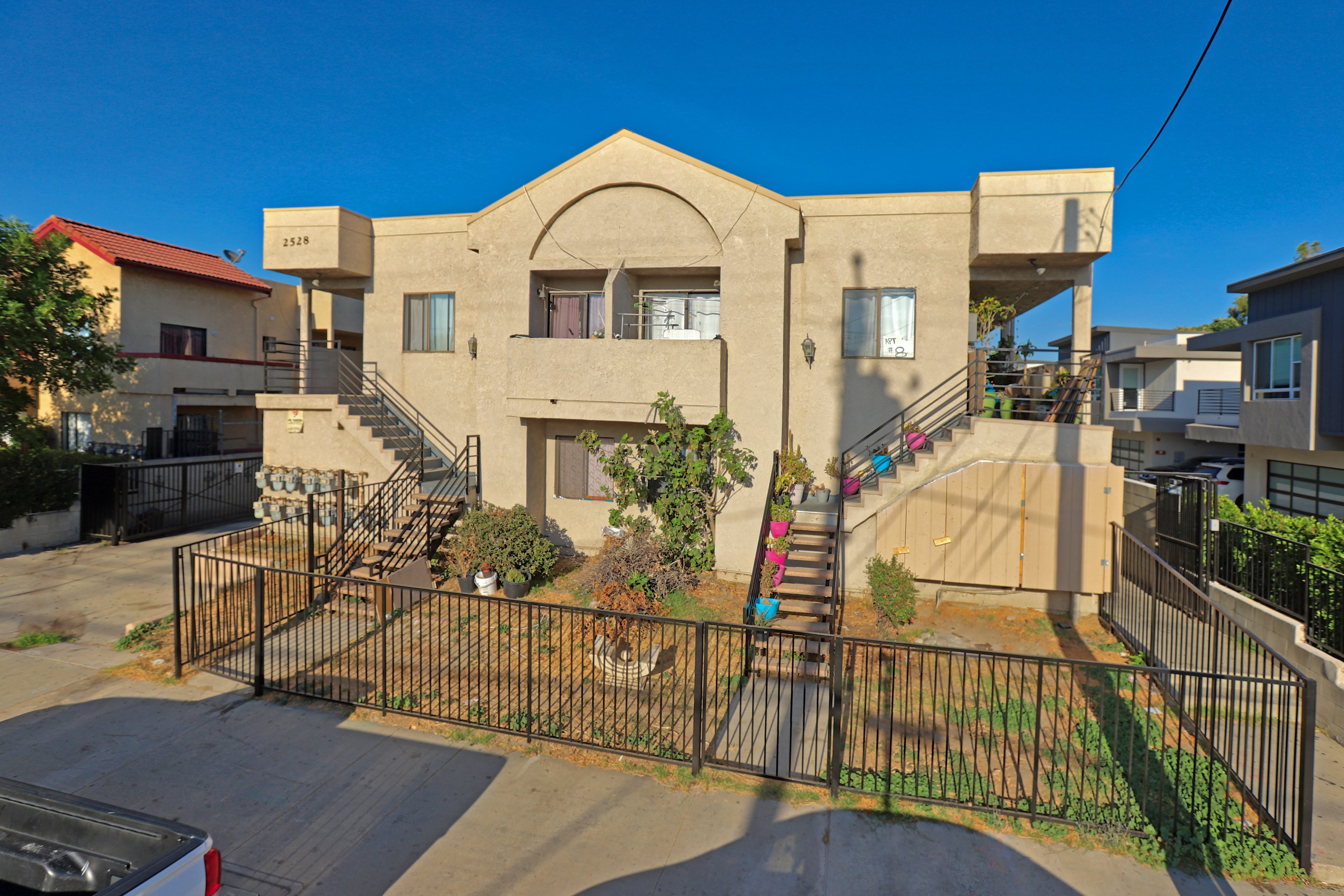 A house with a gate in front of it.